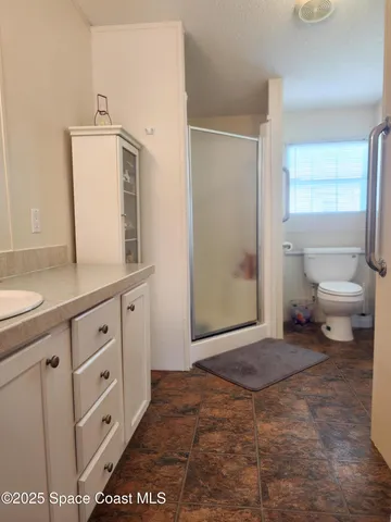 a view of a storage and utility room with closet