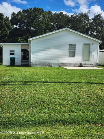 a house with trees in the background