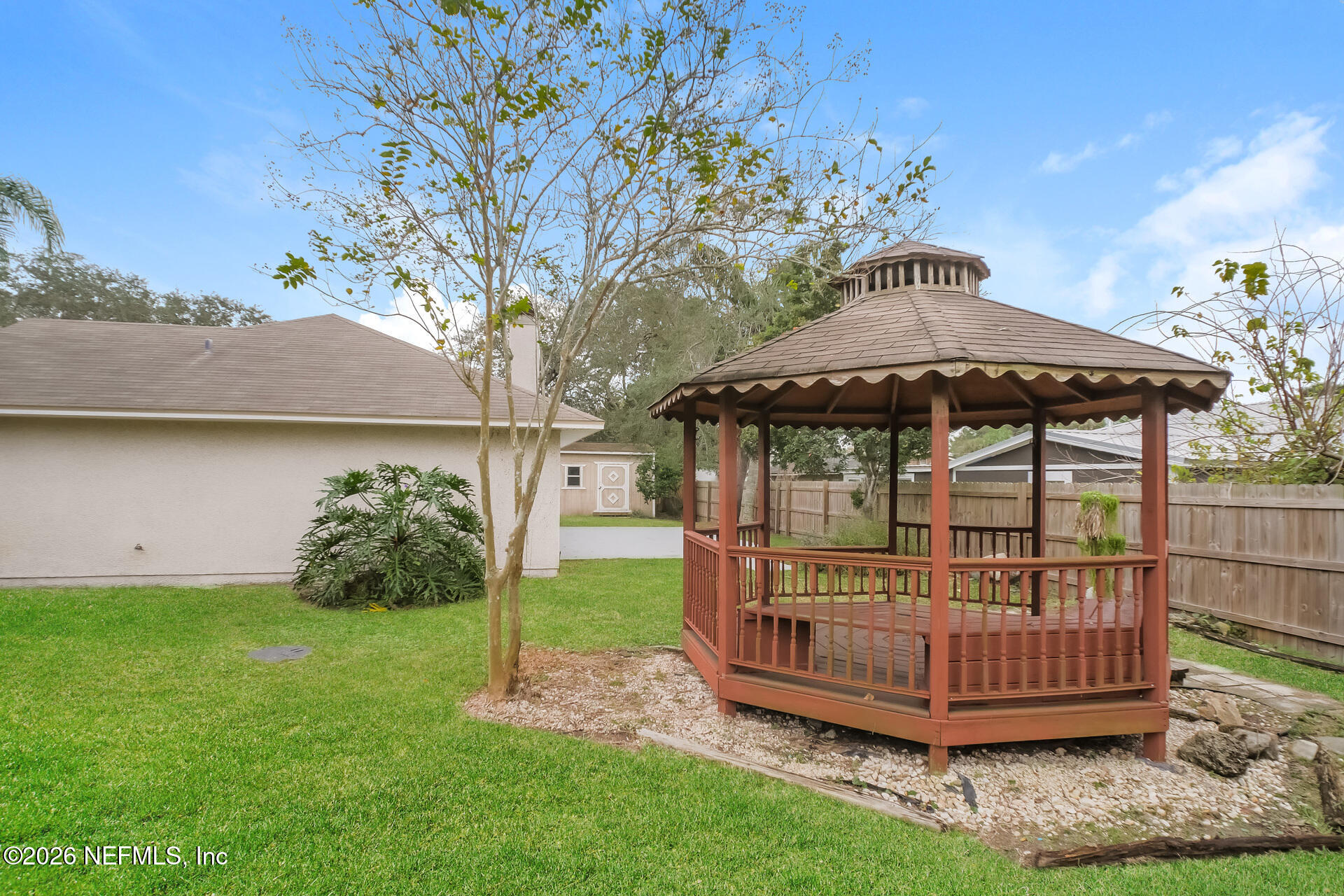 304 Segovia Road St. Augustine, FL 32086 - Photo 15 of 15 a view of a chair and table in the garden