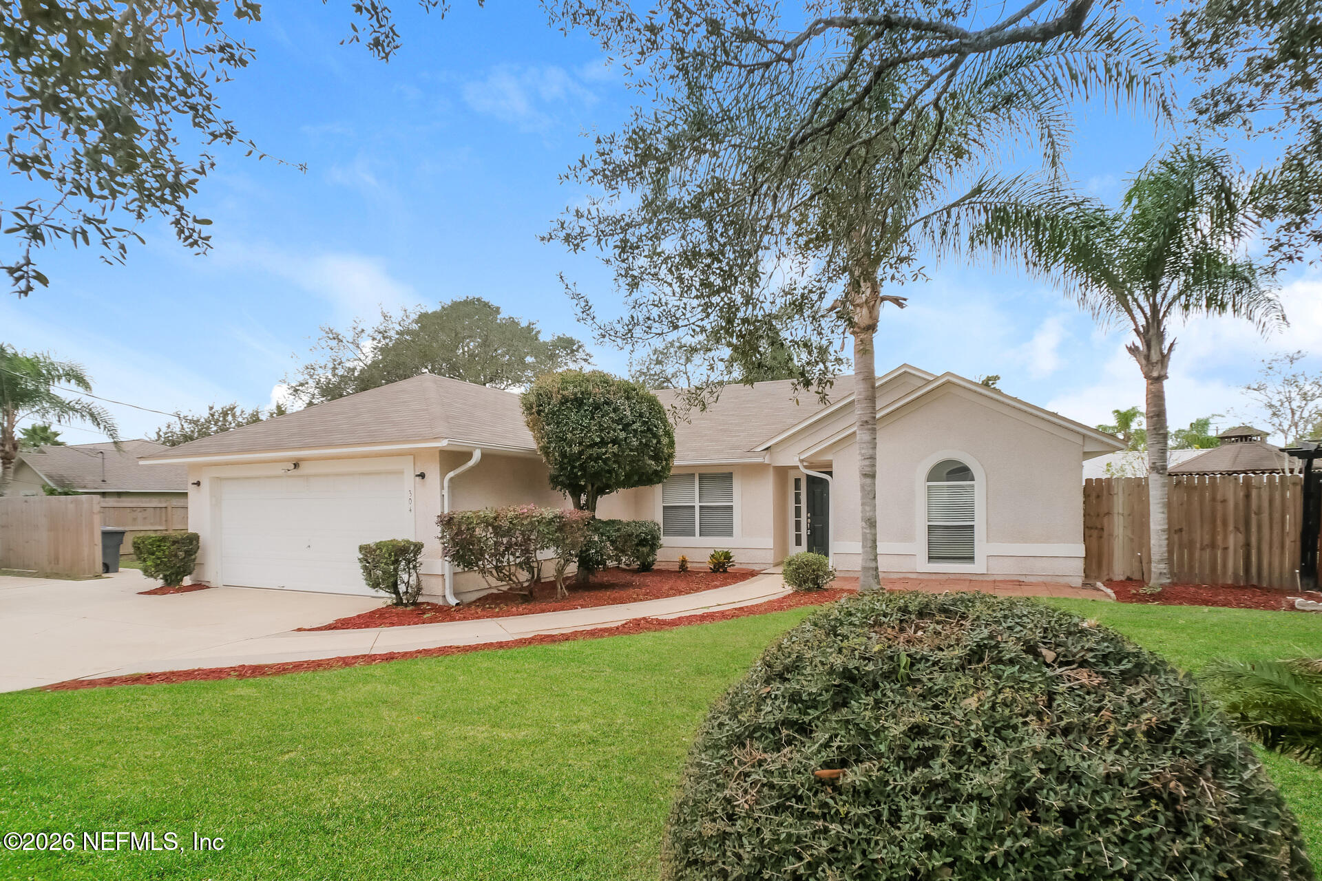 304 Segovia Road St. Augustine, FL 32086 - Photo 2 of 15 a front view of a house with garden