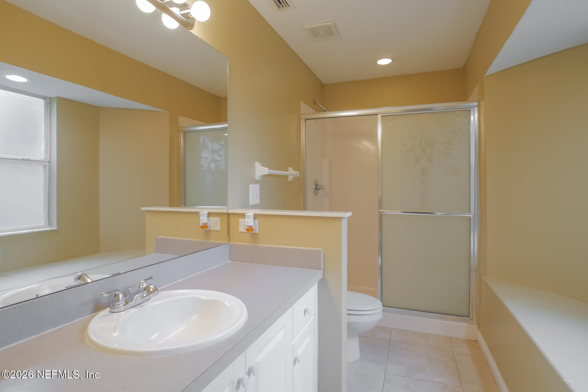 304 Segovia Road St. Augustine, FL 32086 - Photo 9 of 15 a bathroom with a sink a toilet and shower
