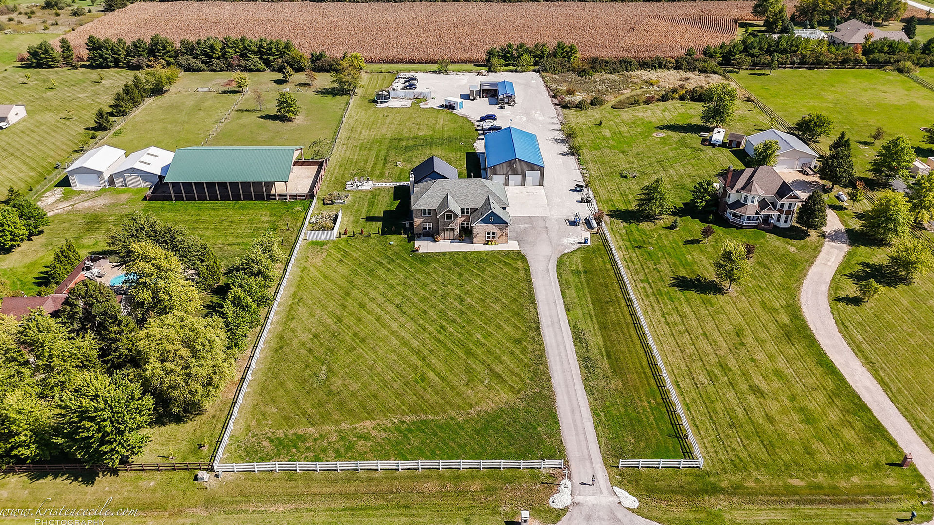 an aerial view of residential houses with outdoor space