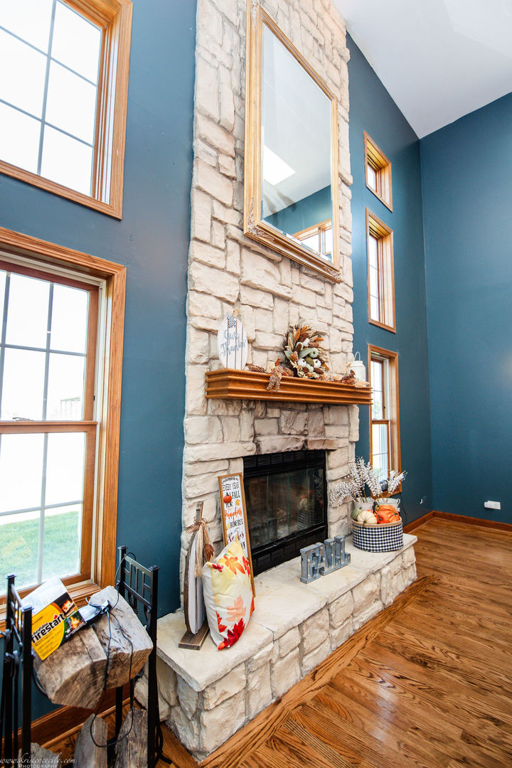 27243 South 88th Avenue Monee, IL 60449 - Photo 20 of 59 a living room with furniture a fireplace and a large window