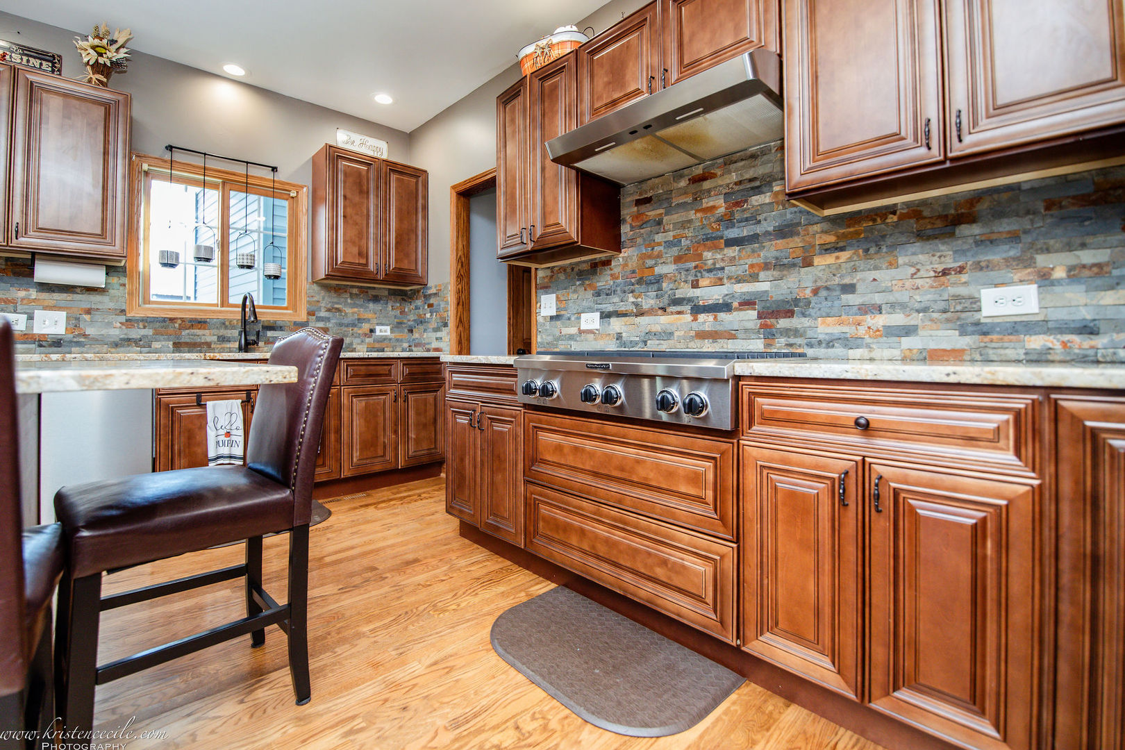 27243 South 88th Avenue Monee, IL 60449 - Photo 27 of 59 a kitchen with stainless steel appliances granite countertop wooden cabinets a sink and dishwasher a stove with wooden floor