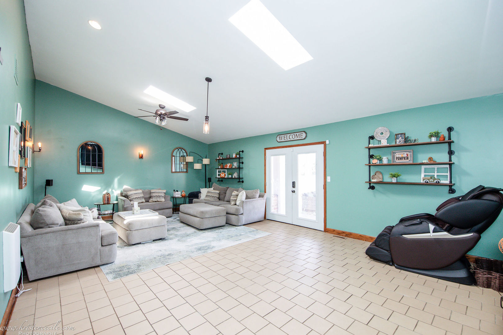 27243 South 88th Avenue Monee, IL 60449 - Photo 30 of 59 a living room with furniture and a chandelier
