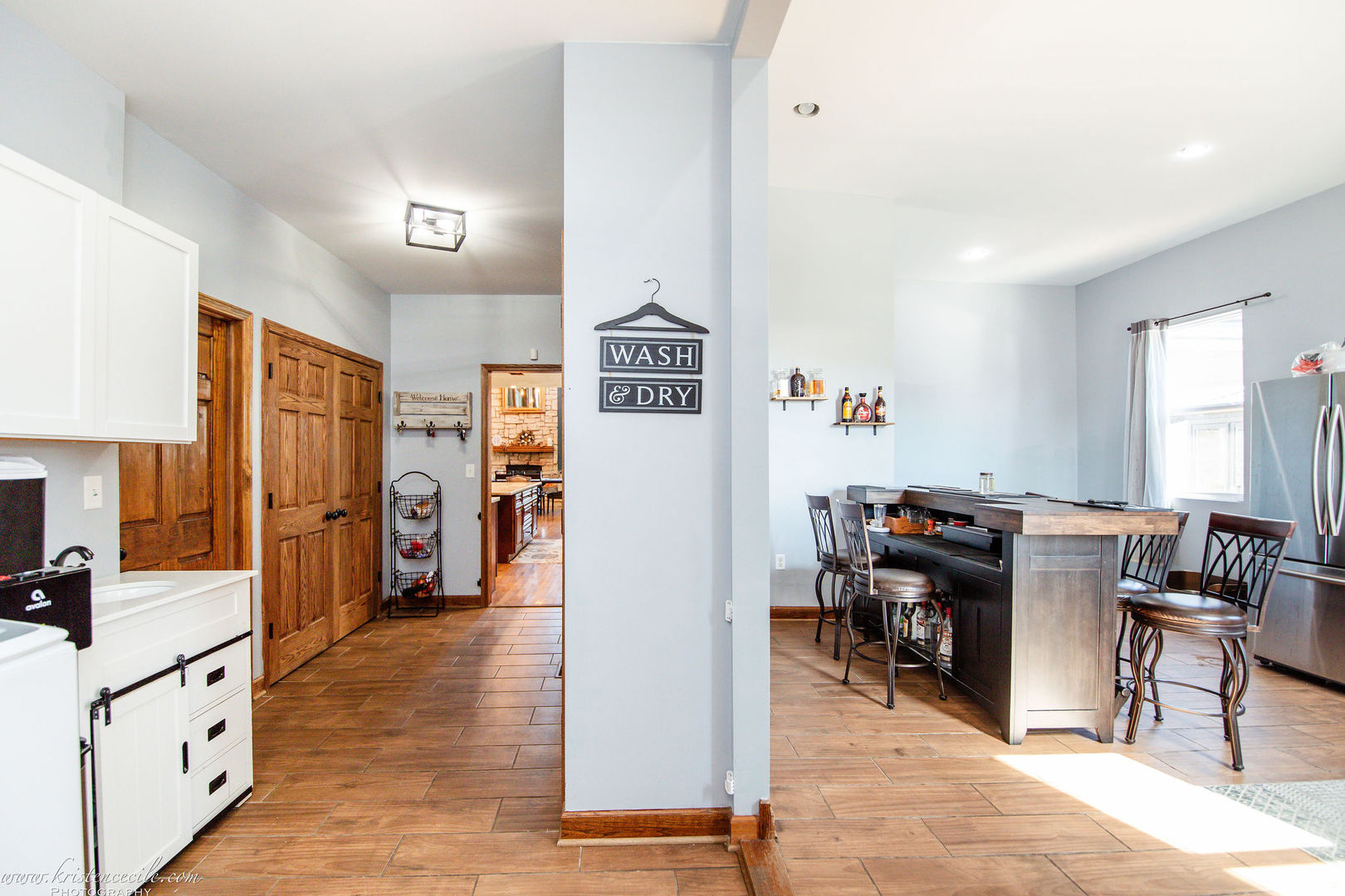 27243 South 88th Avenue Monee, IL 60449 - Photo 35 of 59 a view of a kitchen with furniture and wooden floor