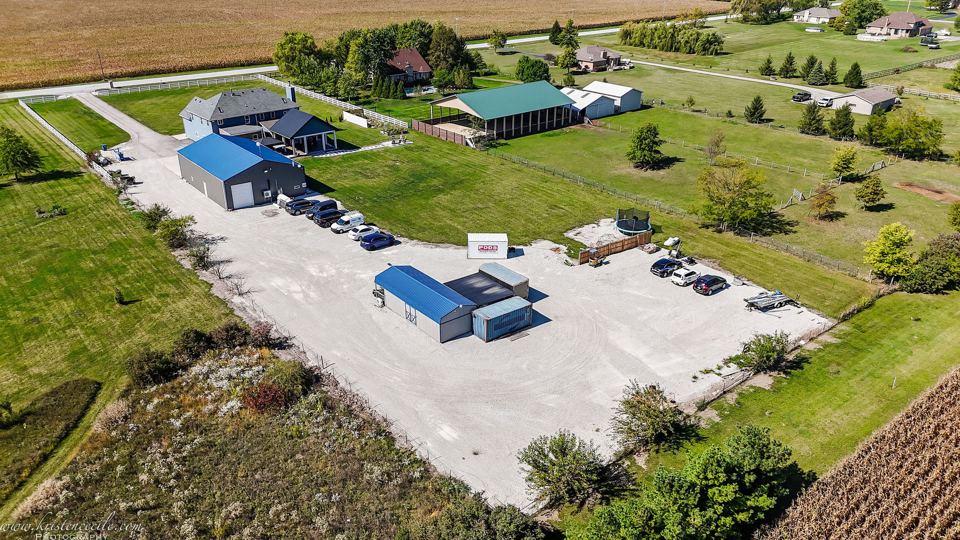 27243 South 88th Avenue Monee, IL 60449 - Photo 55 of 59 an aerial view of a house with a yard and lake view