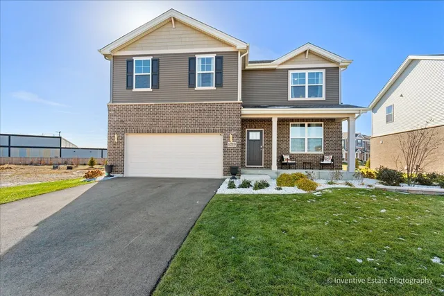 a front view of a house with swimming pool having outdoor seating