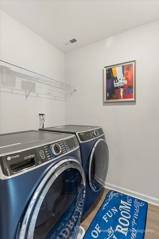 a utility room with dryer and washer