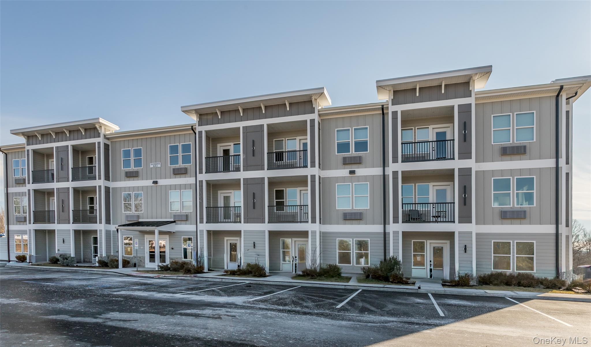 124 South Main Street, Unit 2210 Florida, NY 10921 - Photo 1 of 14 a front view of a building with street view
