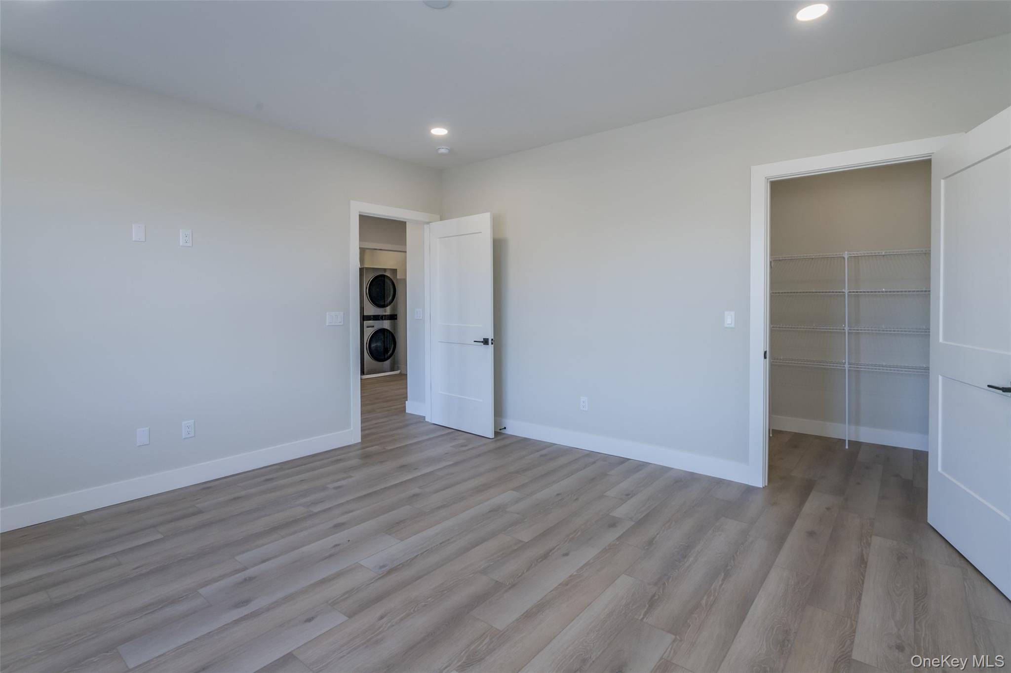 124 South Main Street, Unit 2210 Florida, NY 10921 - Photo 10 of 14 a view of an empty room with wooden floor