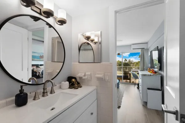 a bathroom with a sink and a mirror