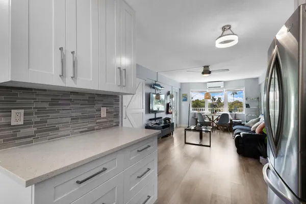 a kitchen with stainless steel appliances a sink a stove and microwave