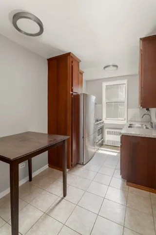 a room with furniture a large window and a chandelier