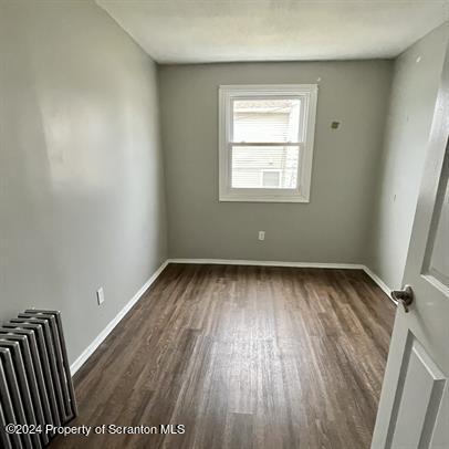 109 Smith Street Dupont, PA 18641 - Photo 4 of 8 a view of a room with wooden floor and window