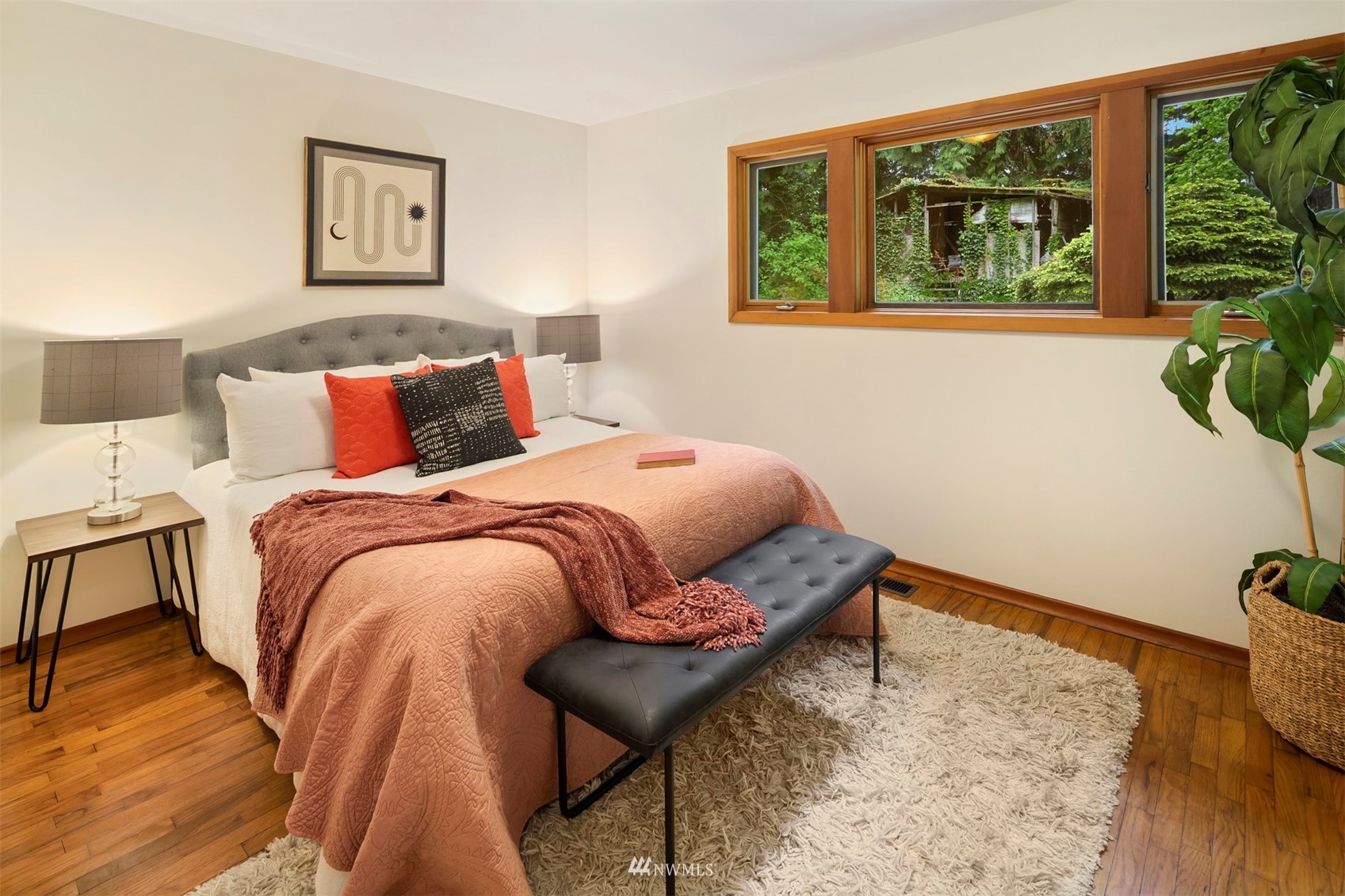 3715 South Webster Street Seattle, WA 98118 - Photo 16 of 39 a bed sitting in a bedroom next to a window