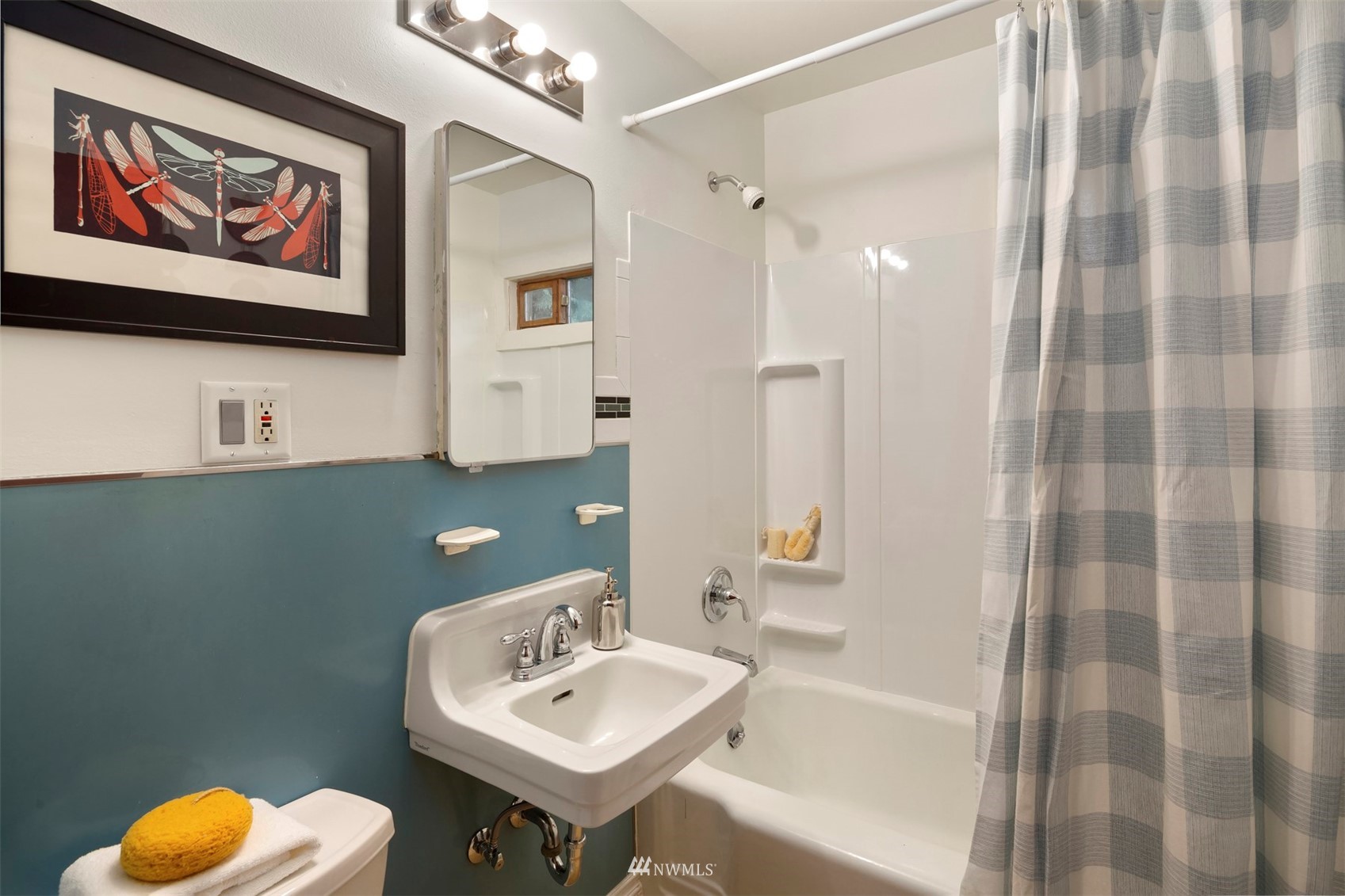 3715 South Webster Street Seattle, WA 98118 - Photo 18 of 39 a bathroom with a sink and a mirror