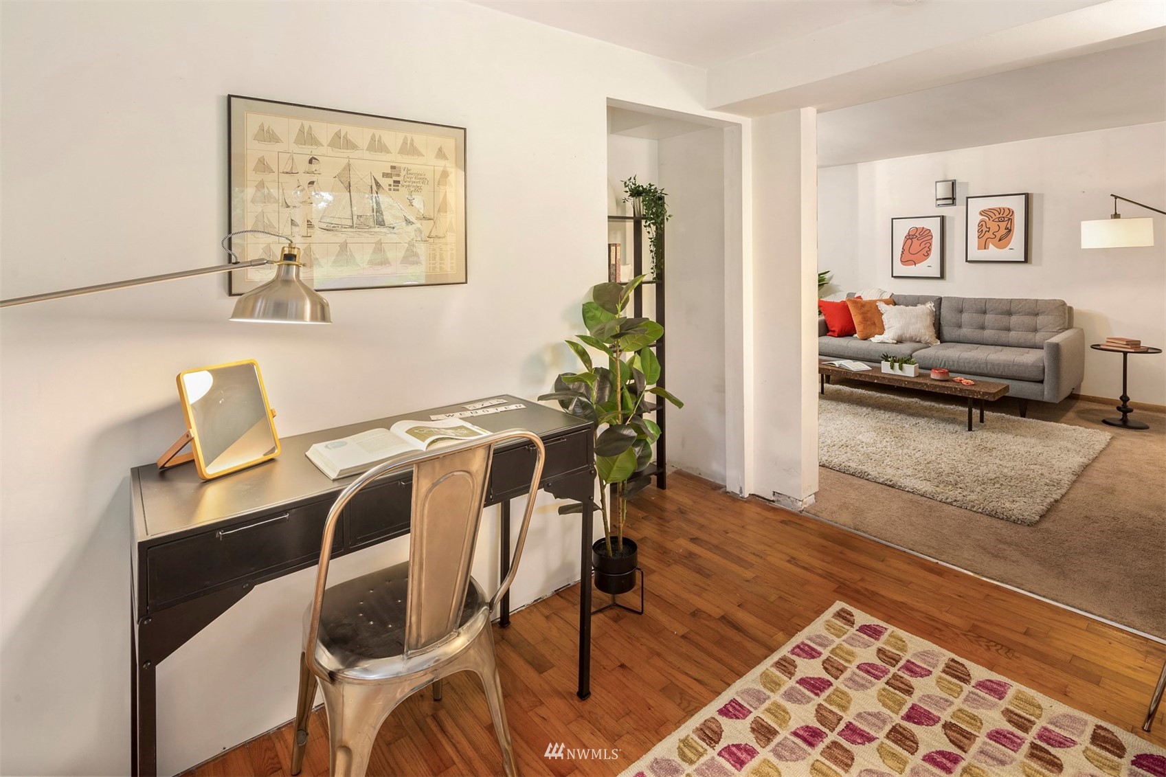 3715 South Webster Street Seattle, WA 98118 - Photo 23 of 39 a view of a workspace with furniture and wooden floor