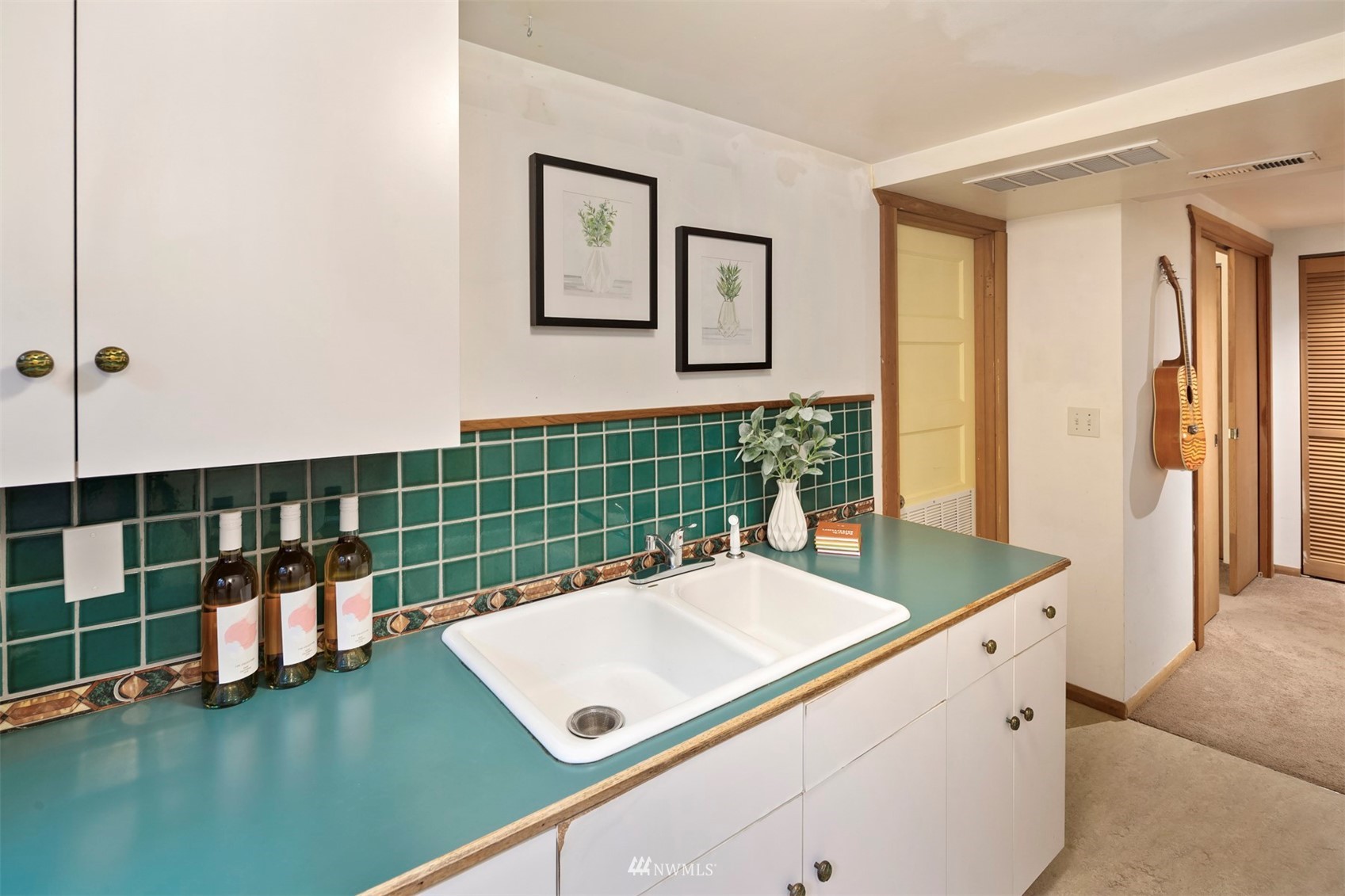 3715 South Webster Street Seattle, WA 98118 - Photo 25 of 39 a bathroom with a sink a large mirror and a shower