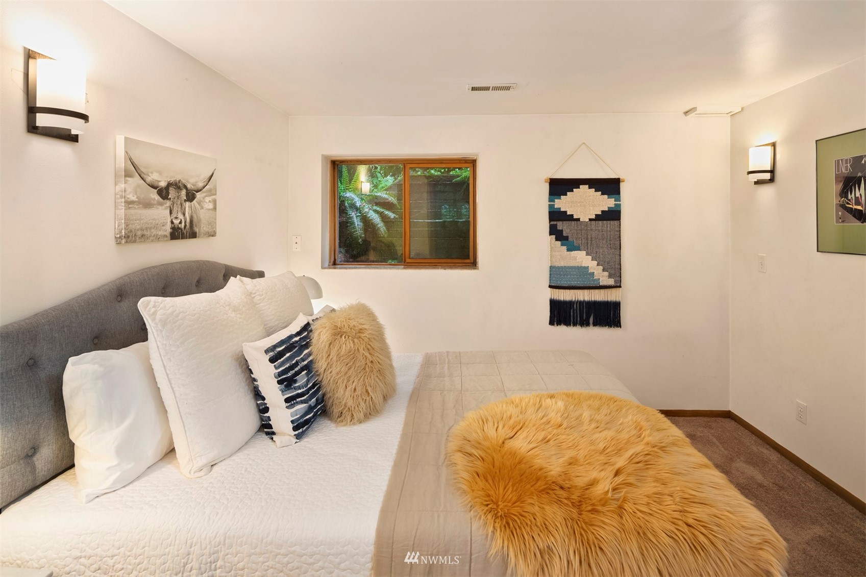 3715 South Webster Street Seattle, WA 98118 - Photo 26 of 39 a bedroom with a bed and a couch