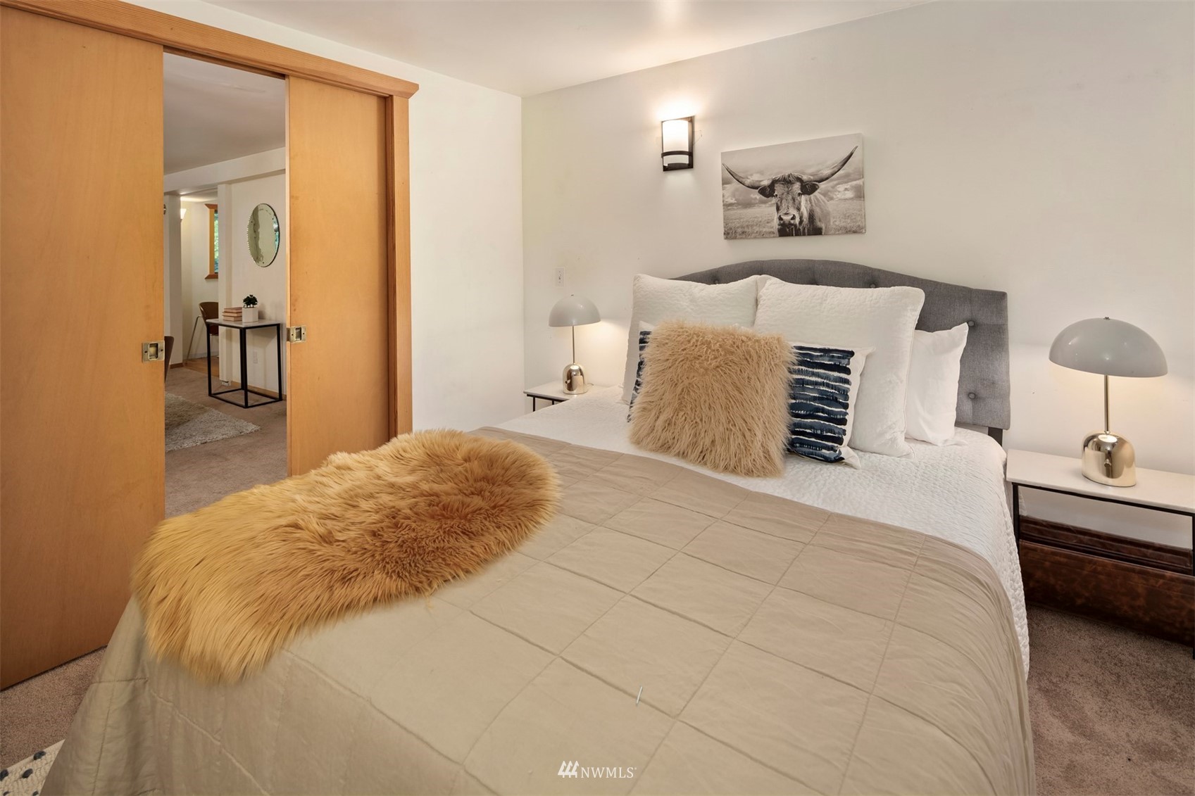 3715 South Webster Street Seattle, WA 98118 - Photo 28 of 39 a bedroom with a bed and wall painting