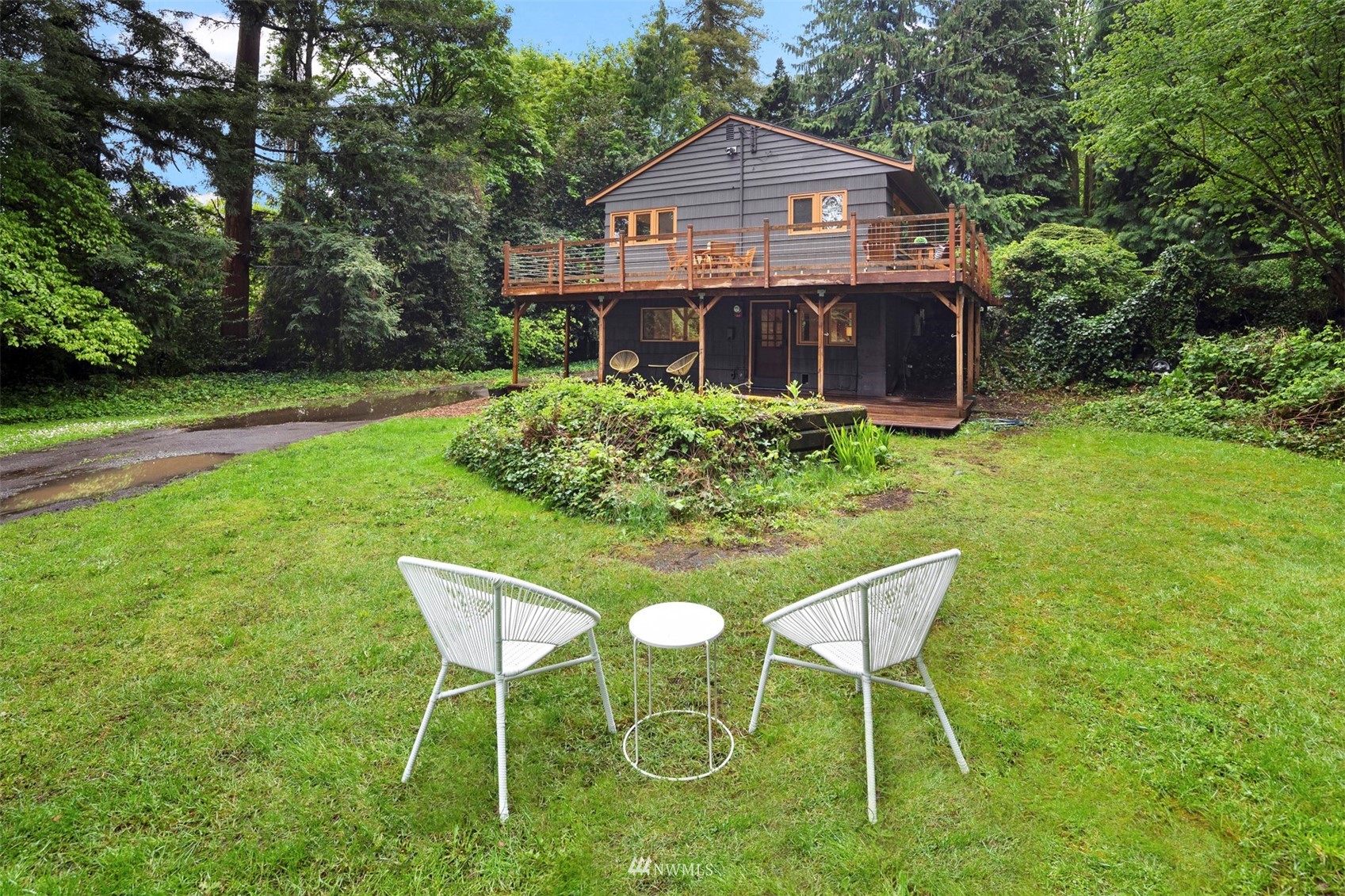 3715 South Webster Street Seattle, WA 98118 - Photo 36 of 39 a front view of a house with a yard table and chairs