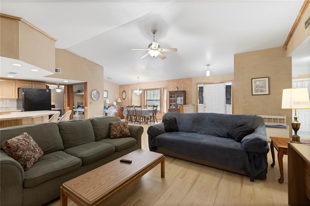 18321 McMullen Road Spring Hill, FL 34610 - Photo 19 of 56 a living room with furniture and a couch