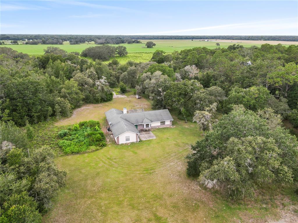 18321 McMullen Road Spring Hill, FL 34610 - Photo 2 of 56 an aerial view of a houses with a yard