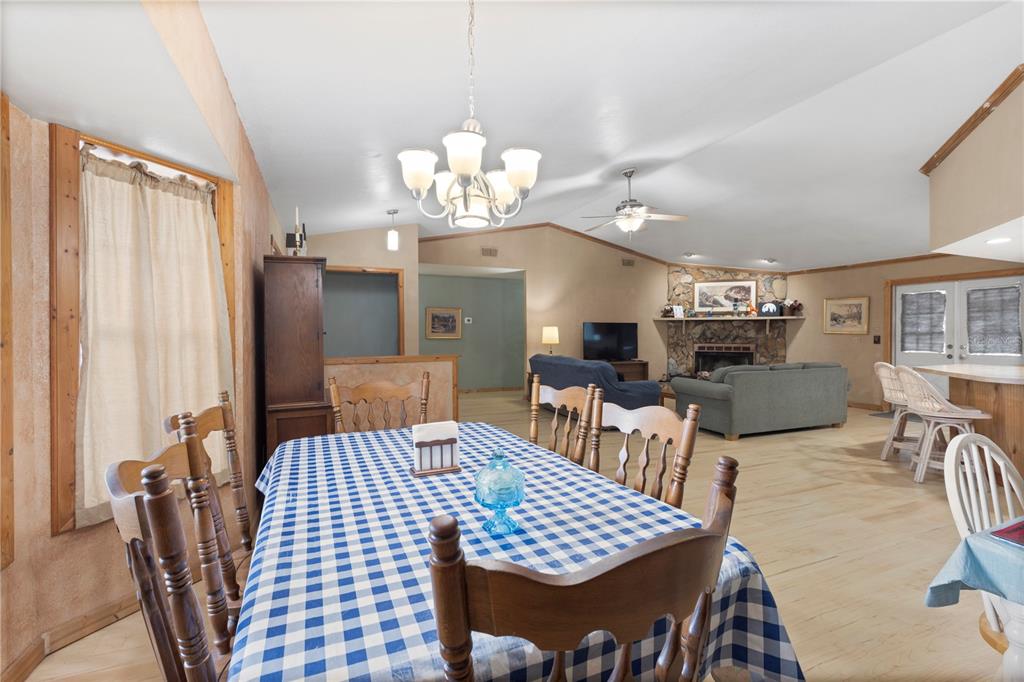 18321 McMullen Road Spring Hill, FL 34610 - Photo 27 of 56 a view of a dining room with furniture