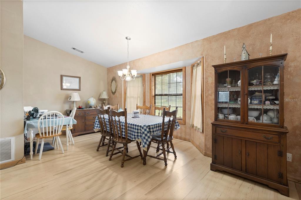 18321 McMullen Road Spring Hill, FL 34610 - Photo 28 of 56 a view of a dining room with furniture