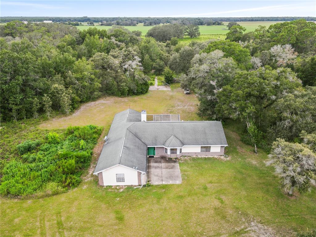 18321 McMullen Road Spring Hill, FL 34610 - Photo 5 of 56 an aerial view of a house with a garden