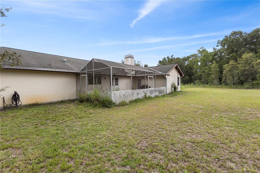 18321 McMullen Road Spring Hill, FL 34610 - Photo 53 of 56 a house view with a garden space