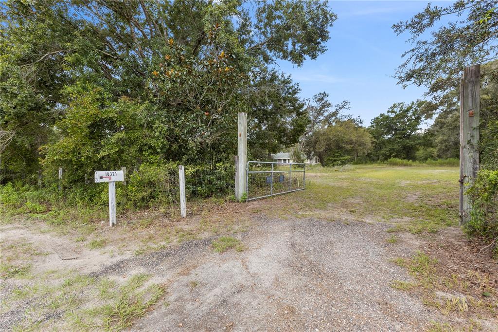 18321 McMullen Road Spring Hill, FL 34610 - Photo 56 of 56 a view of a field with wooden fence