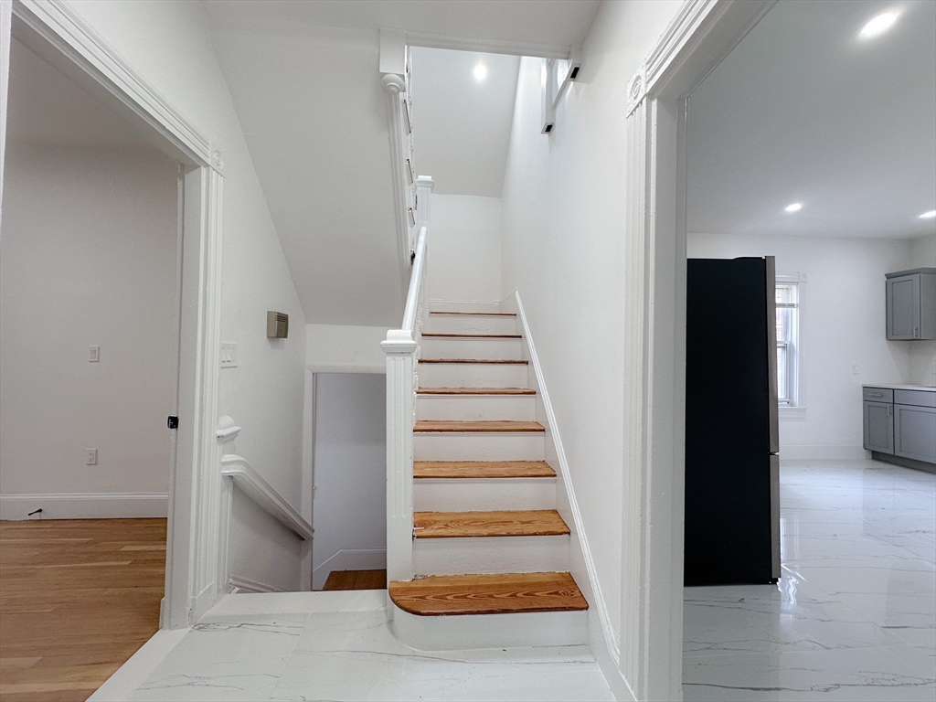 70 Nelson Street, Unit 2 Boston, MA 02124 - Photo 6 of 12 a view of entryway and hall with wooden floor