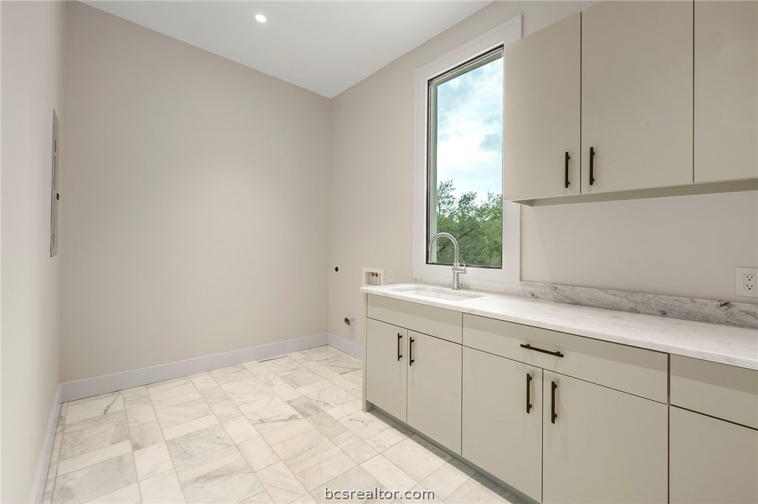 4212 Tuscany Court Bryan, TX 77802 - Photo 27 of 41 a room with a sink cabinets and a window