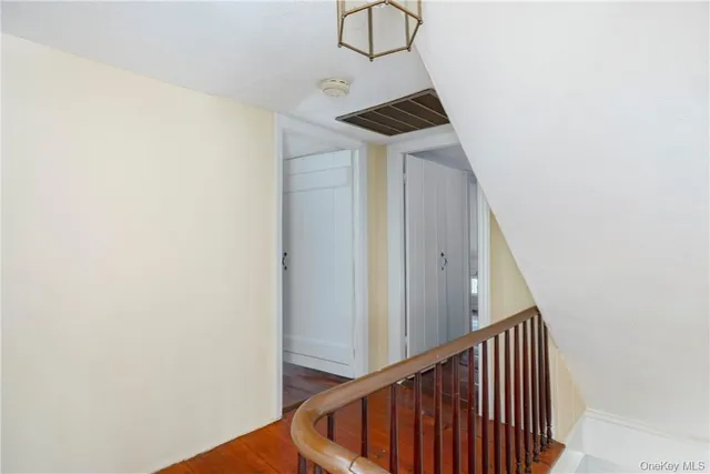 a view of a hallway with stairs