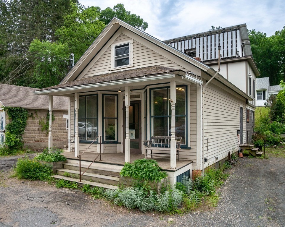 25 Amherst Road Pelham, MA 01002 - Photo 1 of 22 a front view of a house with a garden