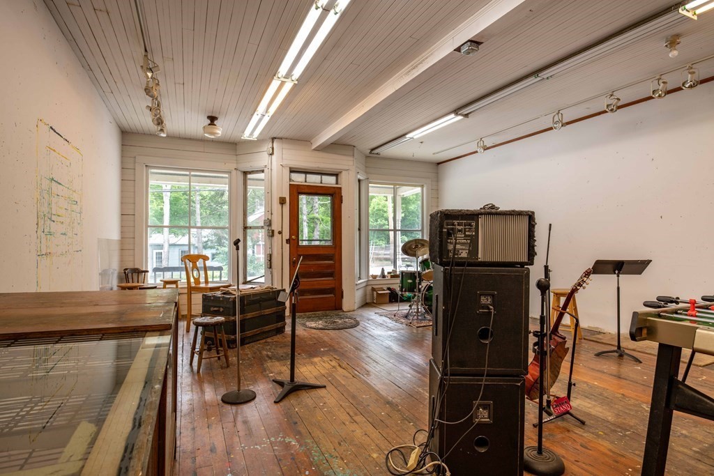25 Amherst Road Pelham, MA 01002 - Photo 12 of 22 a living room with furniture a large window wooden floor and a rug