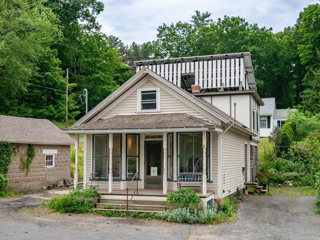 25 Amherst Road Pelham, MA 01002 - Photo 2 of 22 a front view of a house with a porch