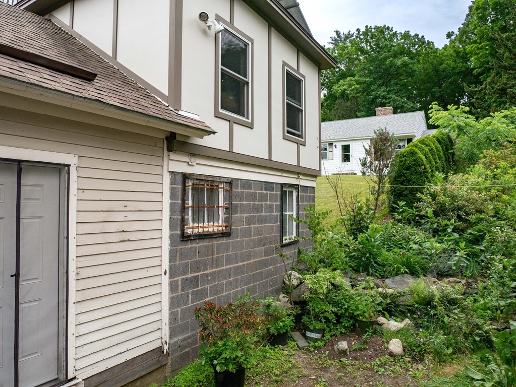 25 Amherst Road Pelham, MA 01002 - Photo 3 of 22 a view of a house with a yard and potted plants