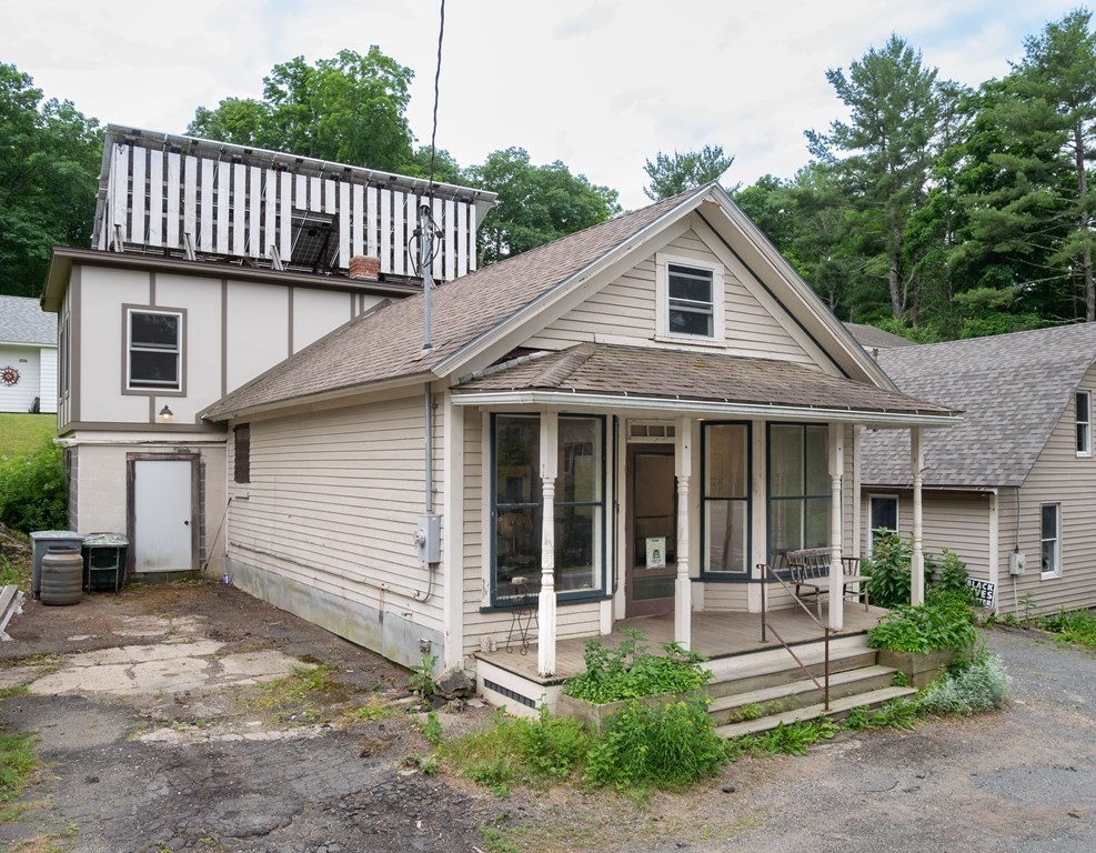 25 Amherst Road Pelham, MA 01002 - Photo 6 of 22 a front view of a house with a garden
