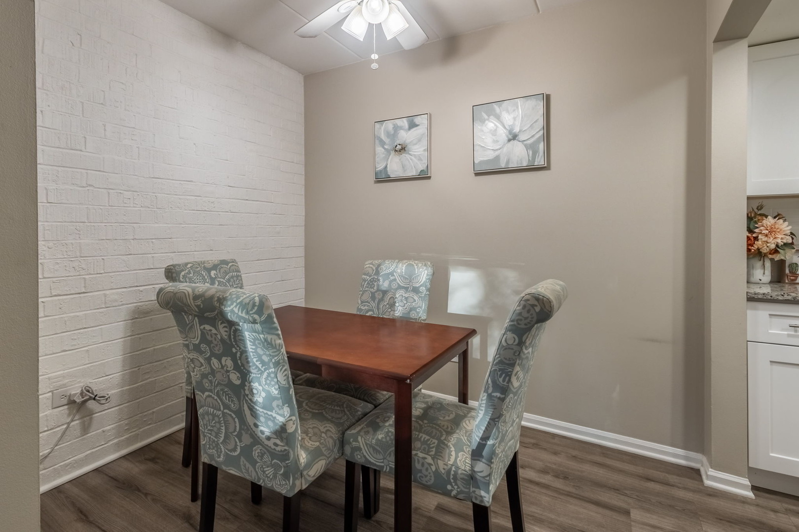 154 East Bailey Road, Unit F Naperville, IL 60565 - Photo 12 of 25 a view of a dining room with furniture and wooden floor