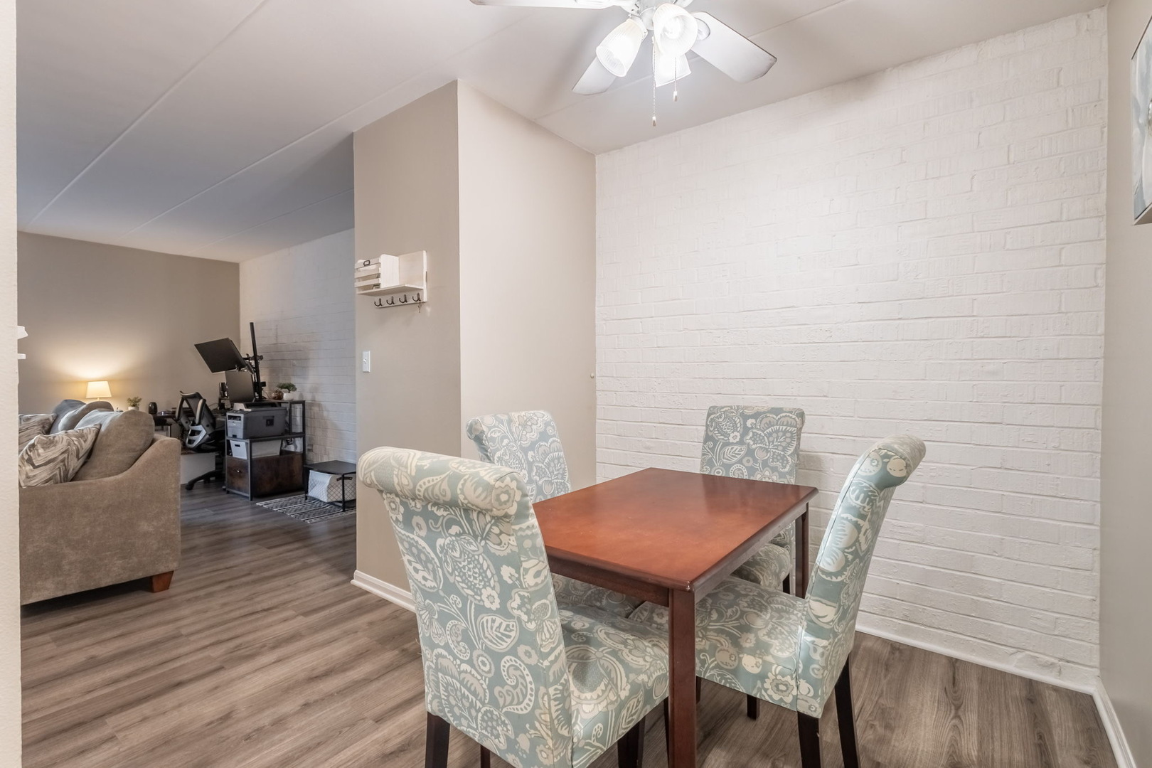 154 East Bailey Road, Unit F Naperville, IL 60565 - Photo 13 of 25 a view of a dining room with furniture and wooden floor