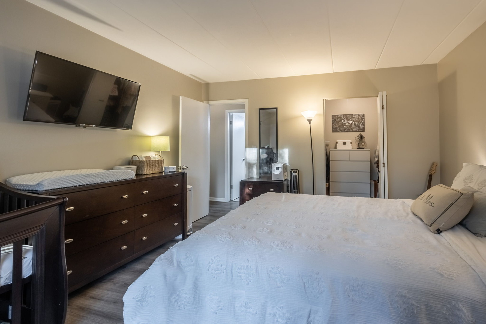 154 East Bailey Road, Unit F Naperville, IL 60565 - Photo 16 of 25 a bedroom with a bed and a flat screen tv