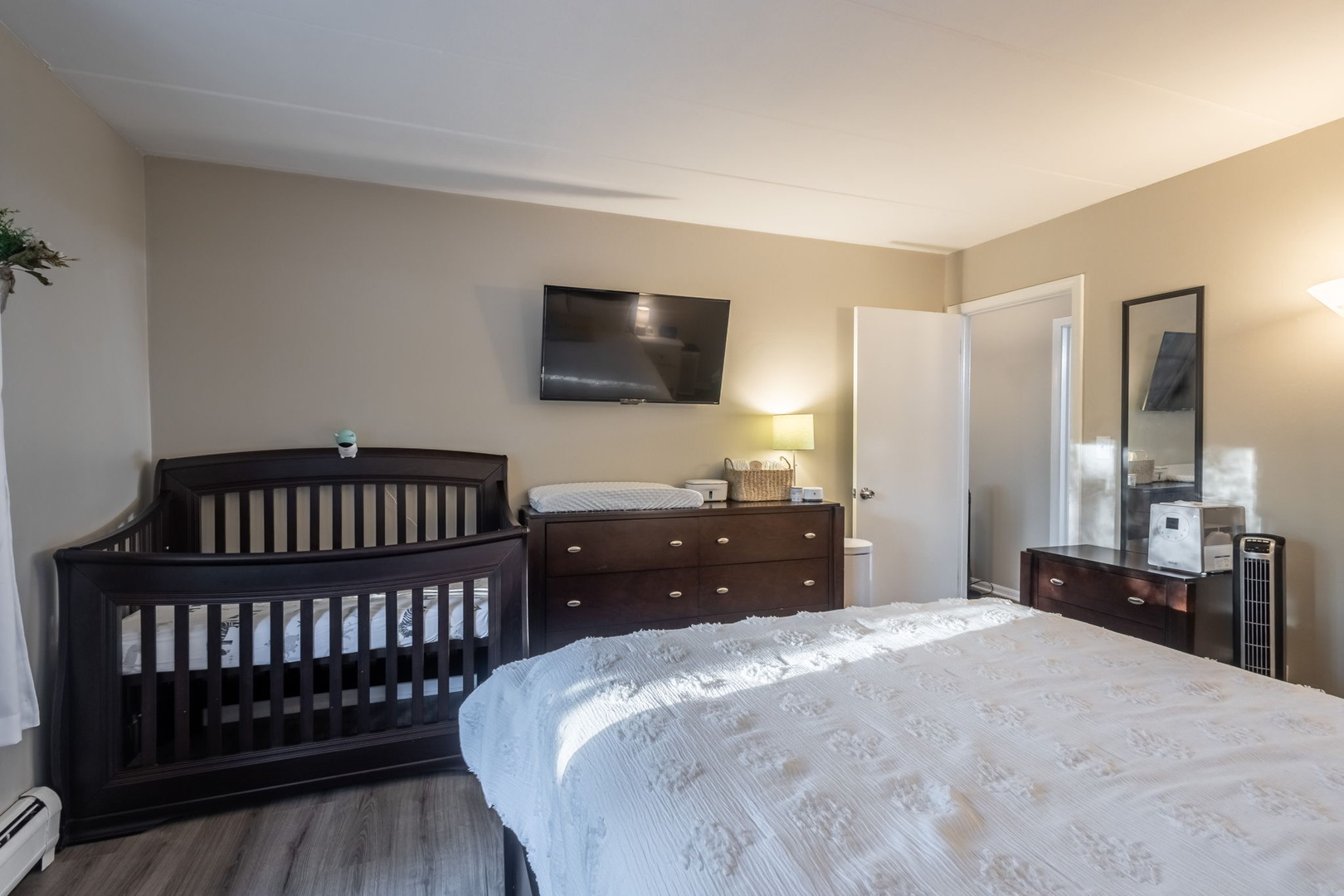 154 East Bailey Road, Unit F Naperville, IL 60565 - Photo 19 of 25 a bedroom with a bed and a flat screen tv