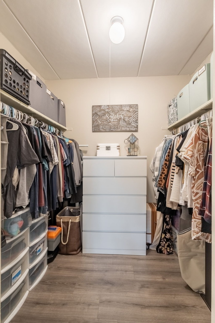 154 East Bailey Road, Unit F Naperville, IL 60565 - Photo 20 of 25 a view of walk in closet with clothes and shoes