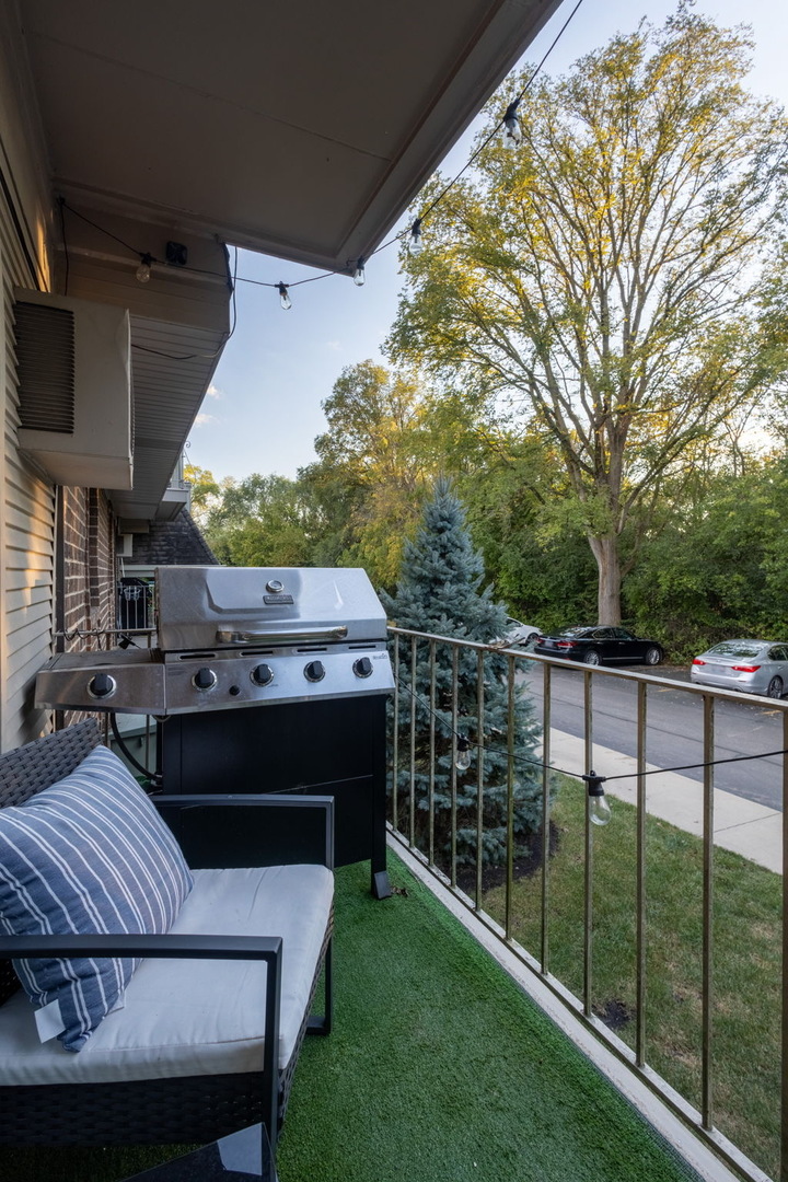 154 East Bailey Road, Unit F Naperville, IL 60565 - Photo 22 of 25 a view of balcony with wooden floor