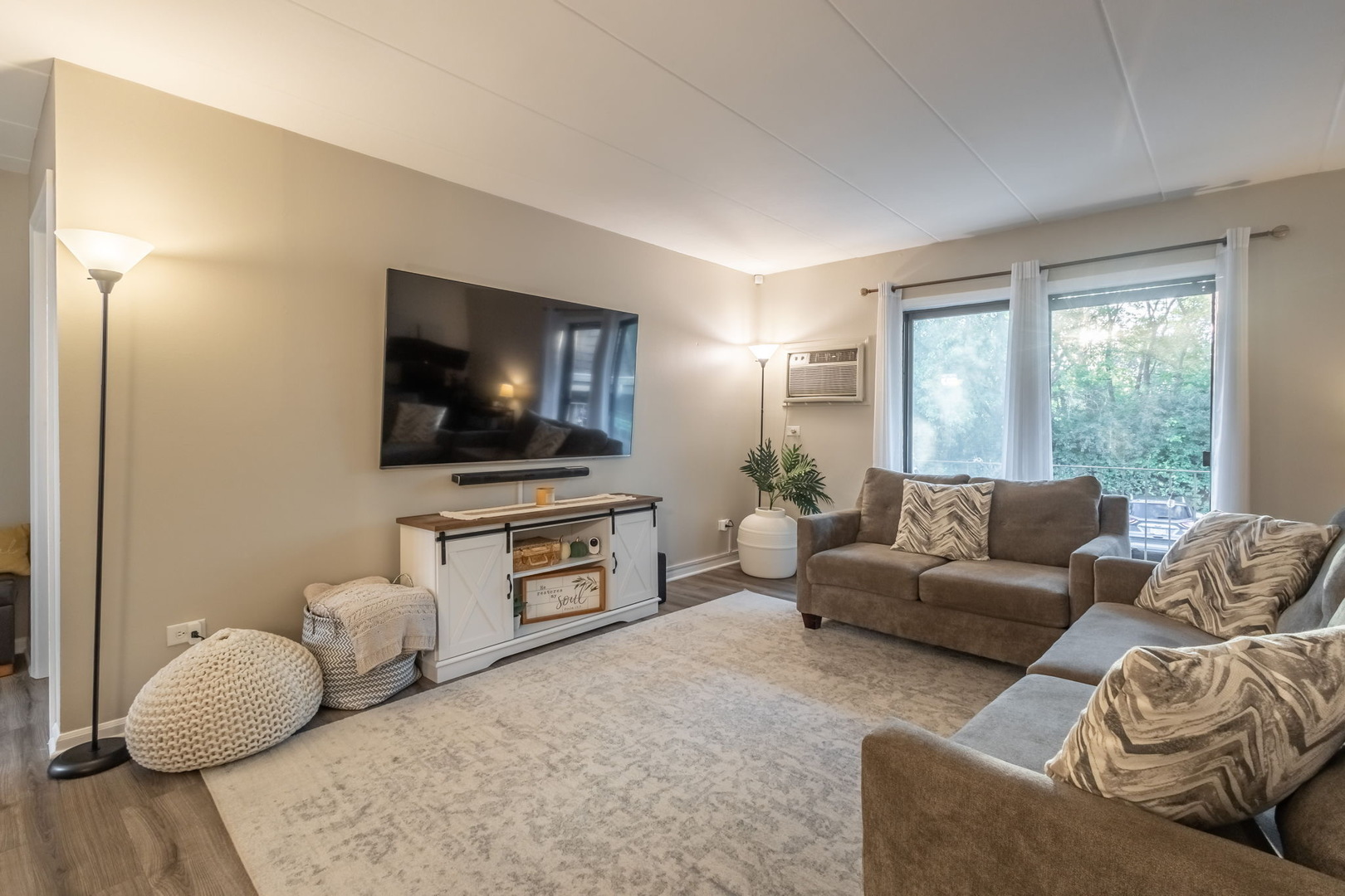 154 East Bailey Road, Unit F Naperville, IL 60565 - Photo 3 of 25 a living room with furniture and a flat screen tv