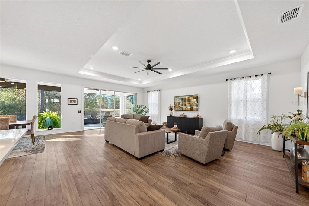 9746 Southwest 108th Terrace Road Ocala, FL 34481 - Photo 15 of 99 a living room with furniture and a large window