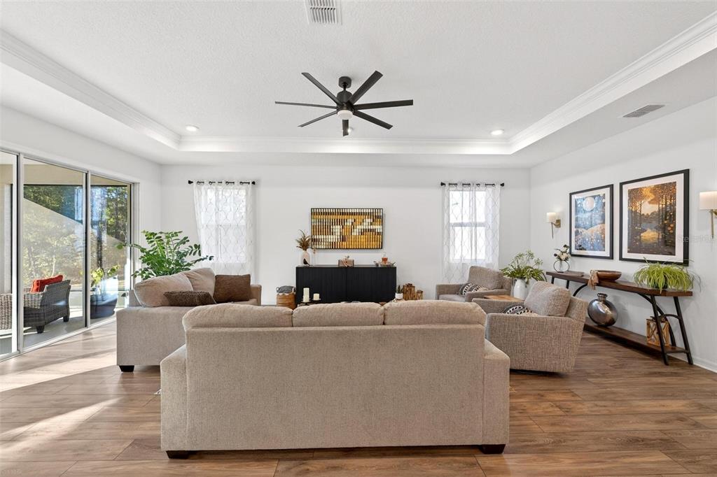 9746 Southwest 108th Terrace Road Ocala, FL 34481 - Photo 17 of 99 a living room with furniture and a large window